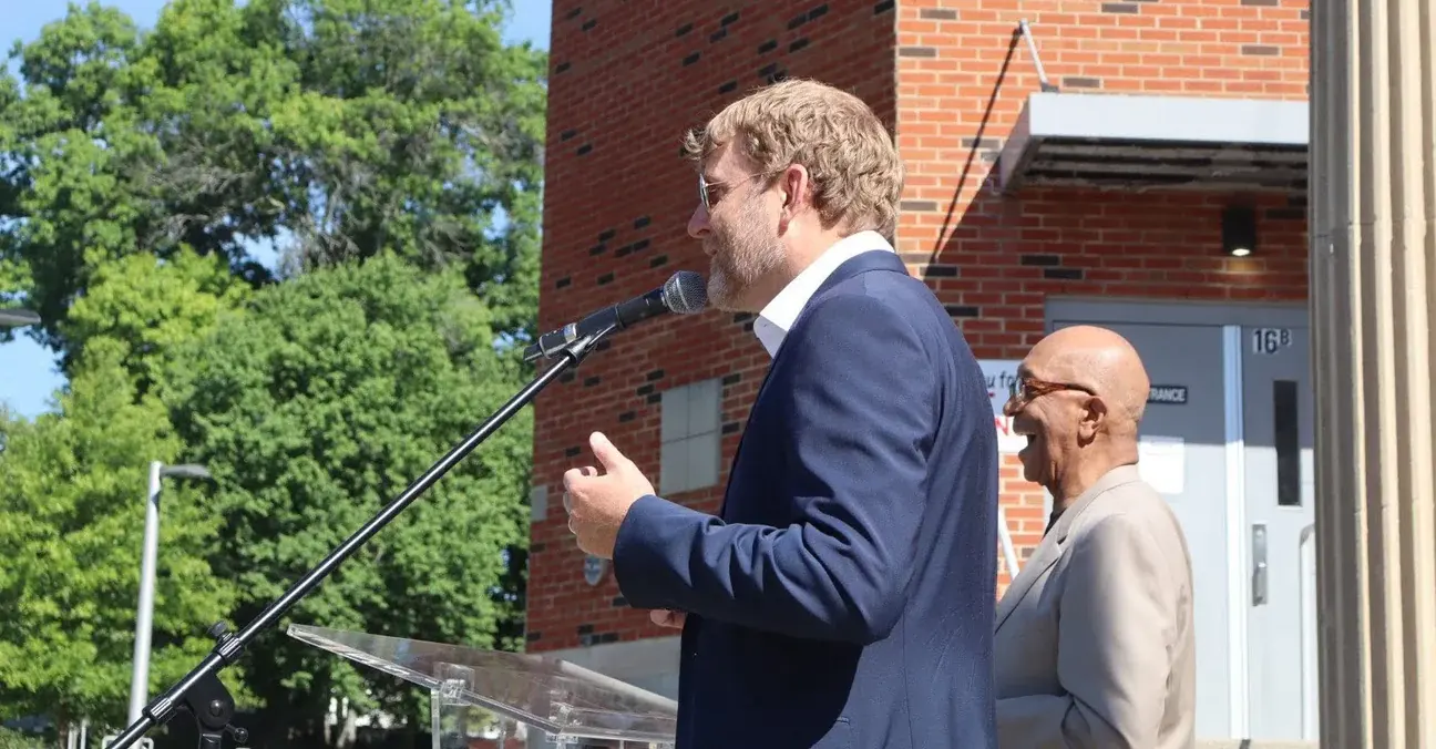 Stephen McCauley speaking at a school and community gathering
