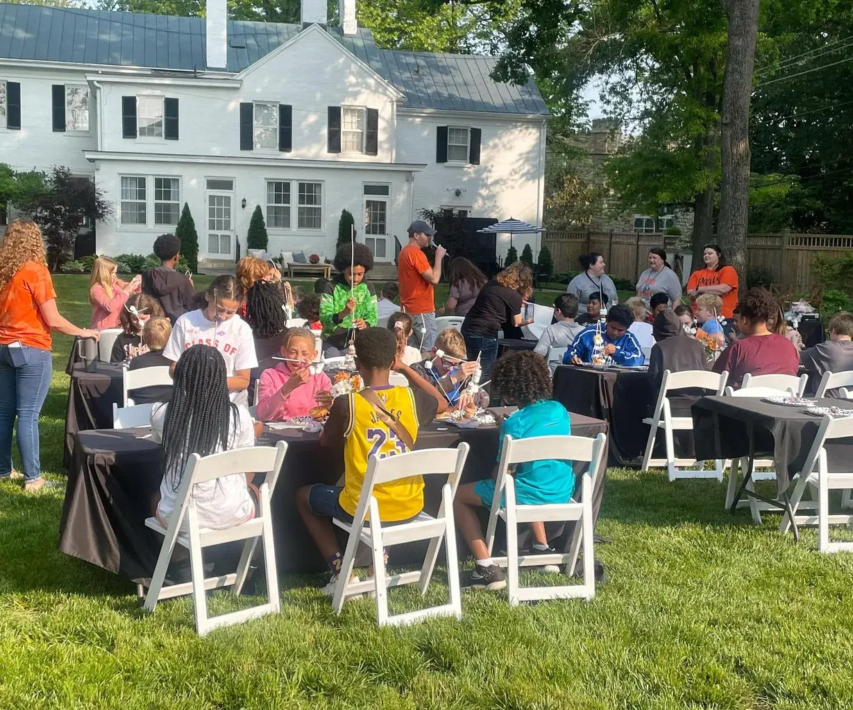 Stephen McCauley hosting a backyard gathering with students from the district