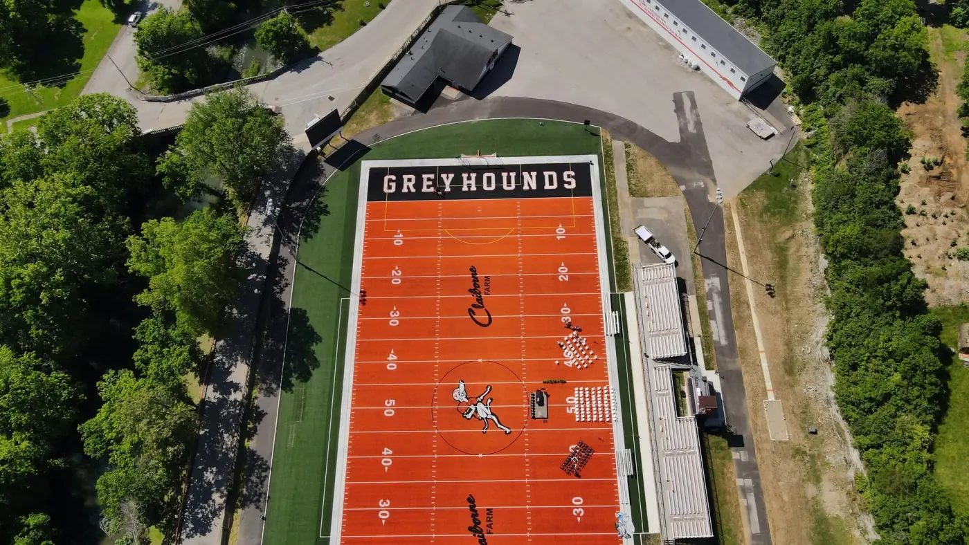Aerial view of the new orange turf football field at Paris City Schools